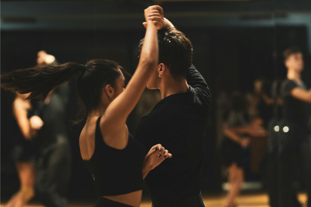 An intimate couple sharing a romantic moment during a Salsa Couples Retreat date night, embodying the Fantasy Retreat promise of passion and sensory discovery.